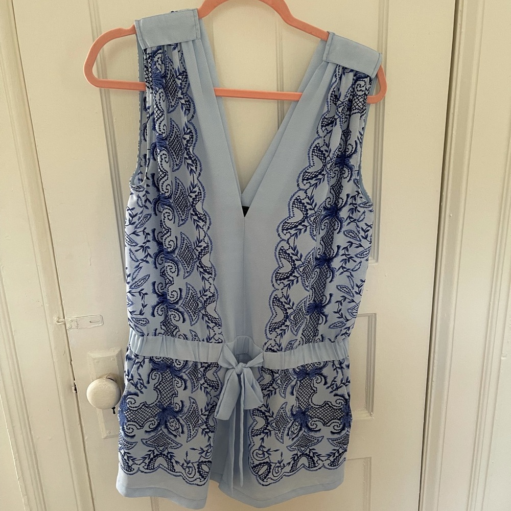 Cute romper with blue floral pattern